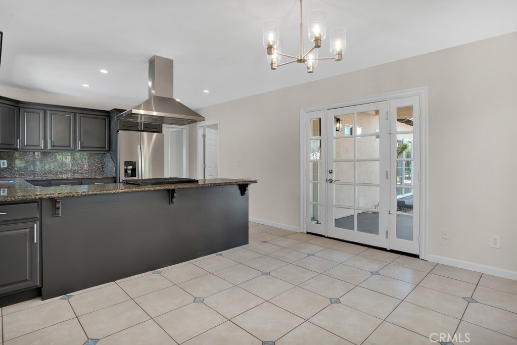 7635 Fallbrook Avenue West Hills, CA 91304 - Photo 7 of 26 a kitchen with kitchen island sink and granite counter top