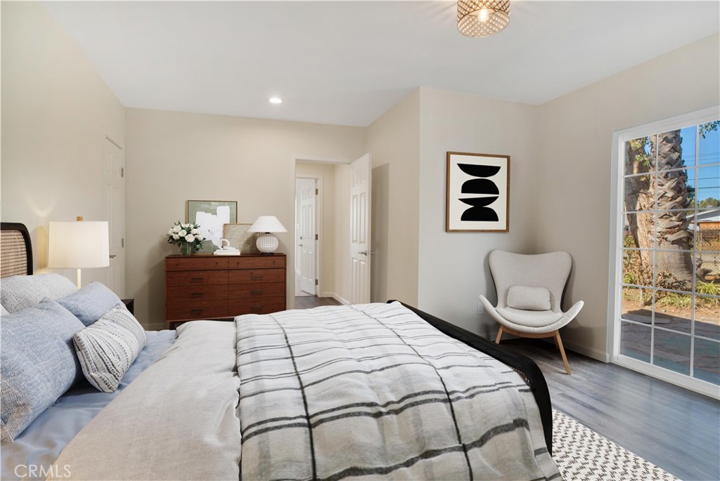 7635 Fallbrook Avenue West Hills, CA 91304 - Photo 10 of 26 a bedroom with a bed and a chair