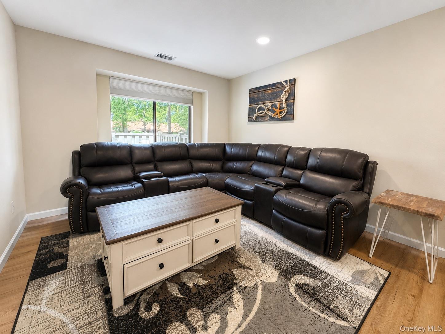 201 Birchwood Road, Unit 201 Coram, NY 11727 - Photo 10 of 27 a living room with furniture and a window