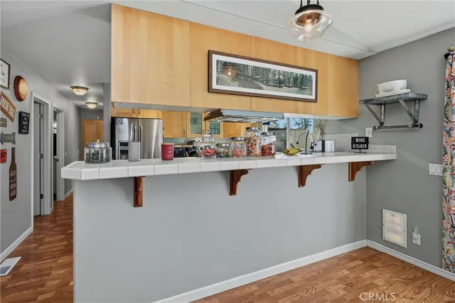 a kitchen with stainless steel appliances granite countertop a sink and cabinets