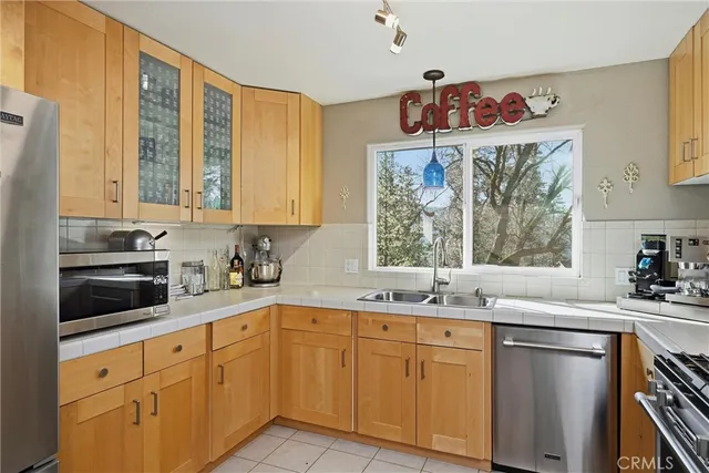 a kitchen with a sink cabinets and window