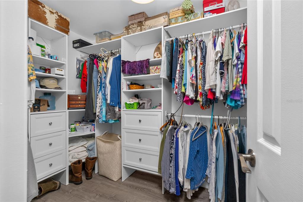 219 Caddy Road Rotonda West, FL 33947 - Photo 46 of 89 a view of walk in closet with clothes