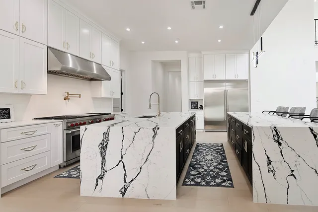 a kitchen with a sink stove and cabinets
