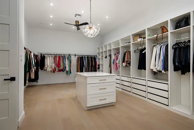 a bathroom with a sink a shower a mirror and a bathtub