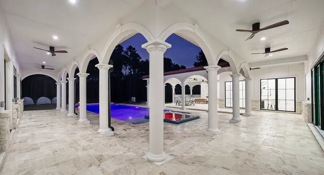 a view of a chairs and table in th patio