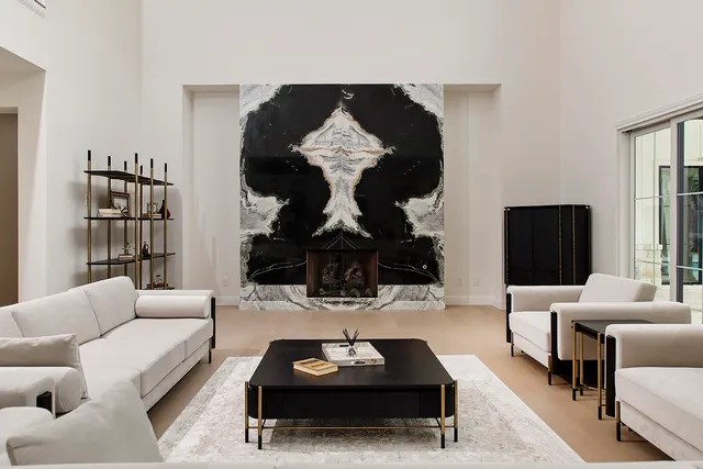 a living room with furniture a rug and a flat screen tv