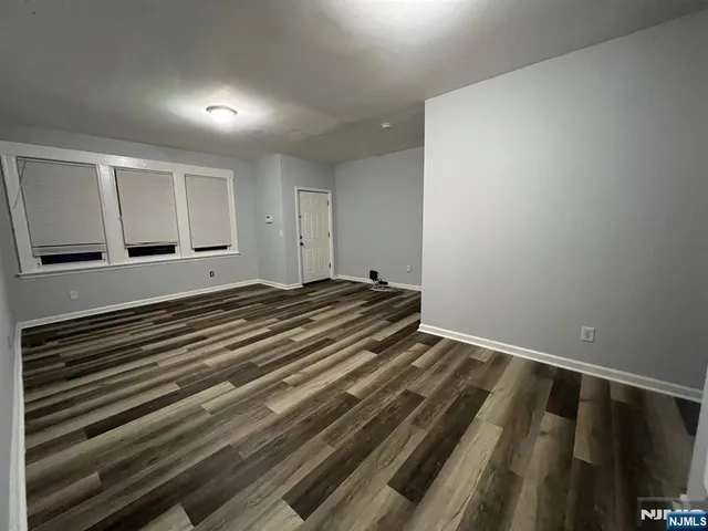 a view of room with wooden floor