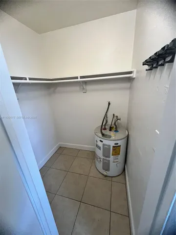 a utility room with cabinets