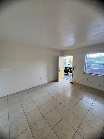 a view of an empty room and window