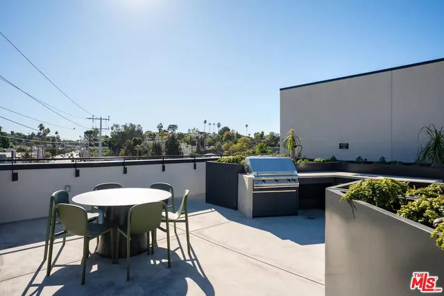 a kitchen with a table and chairs in it