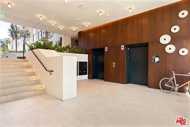 a view of a livingroom with furniture and a front door