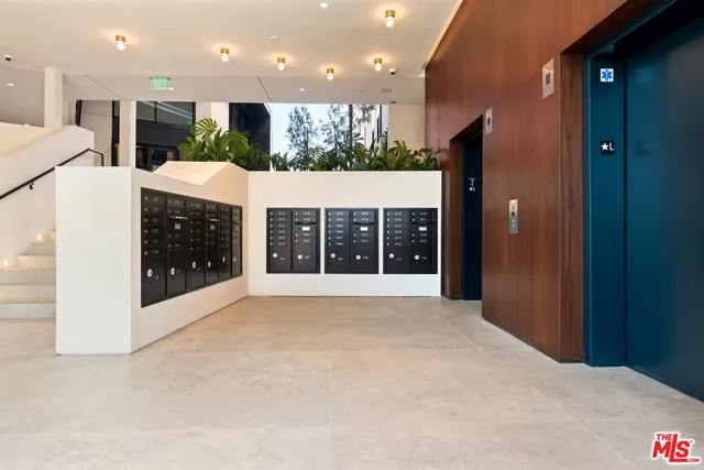 a view of a kitchen with a sink and a large window