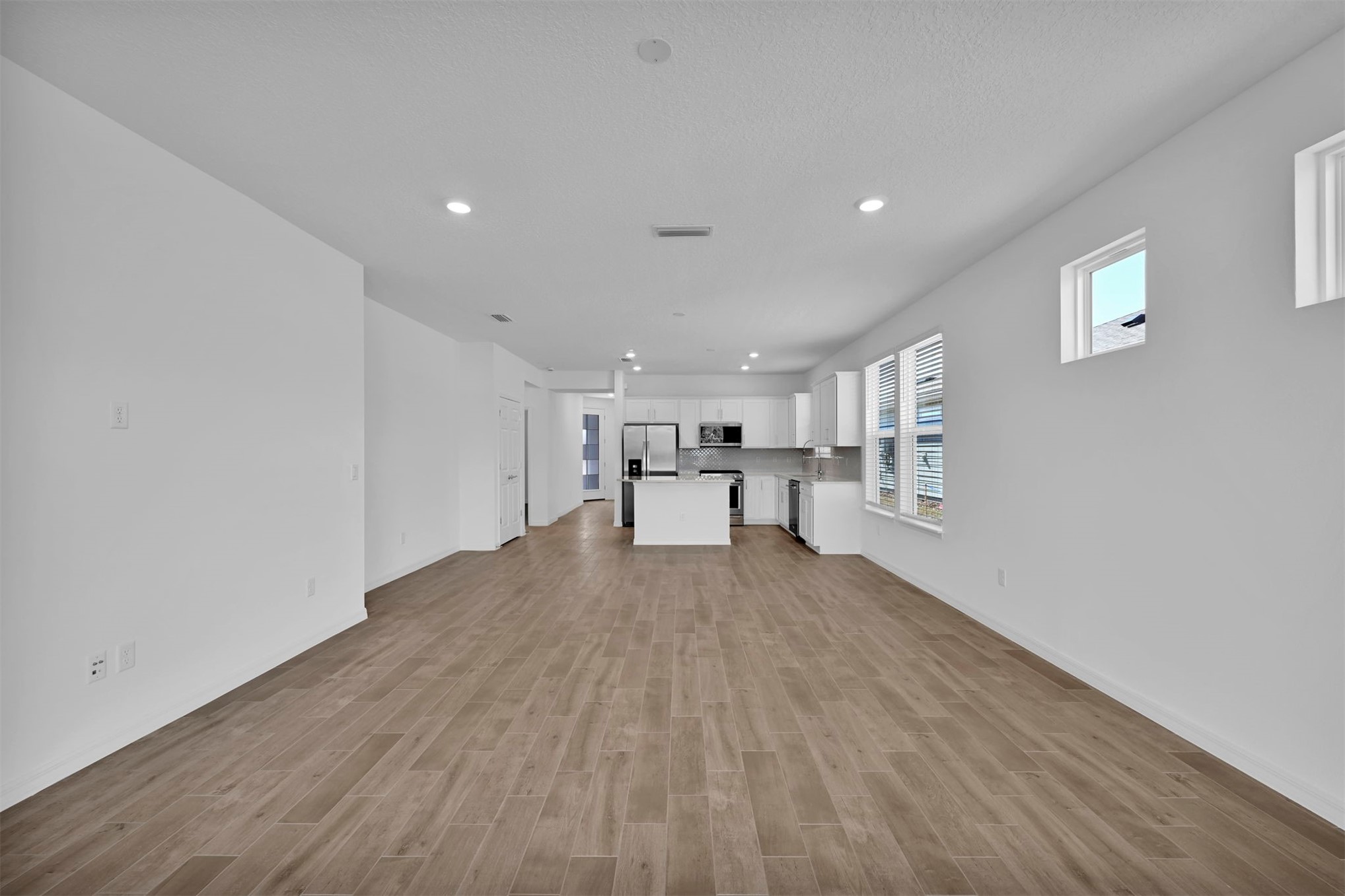 285 Ecliptic Loop Yulee, FL 32097 - Photo 14 of 42 a view of a livingroom with furniture and wooden floor