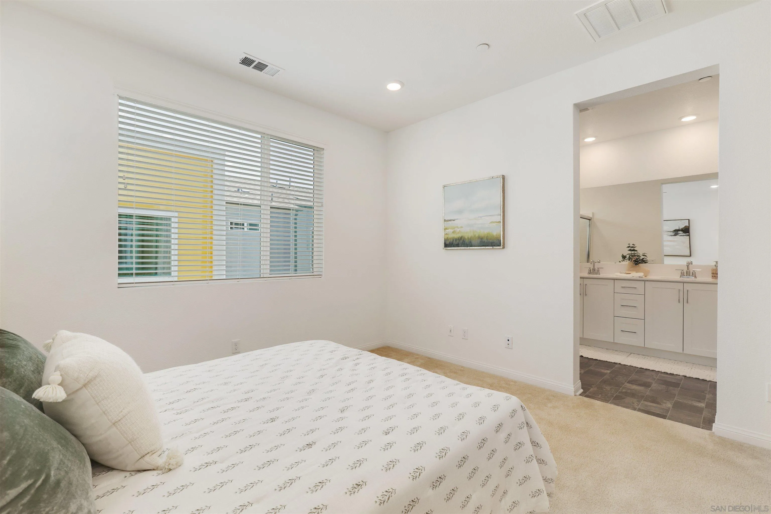 1982 Affinity Lane Chula Vista, CA 91915 - Photo 15 of 34 a bedroom with a bed and a window