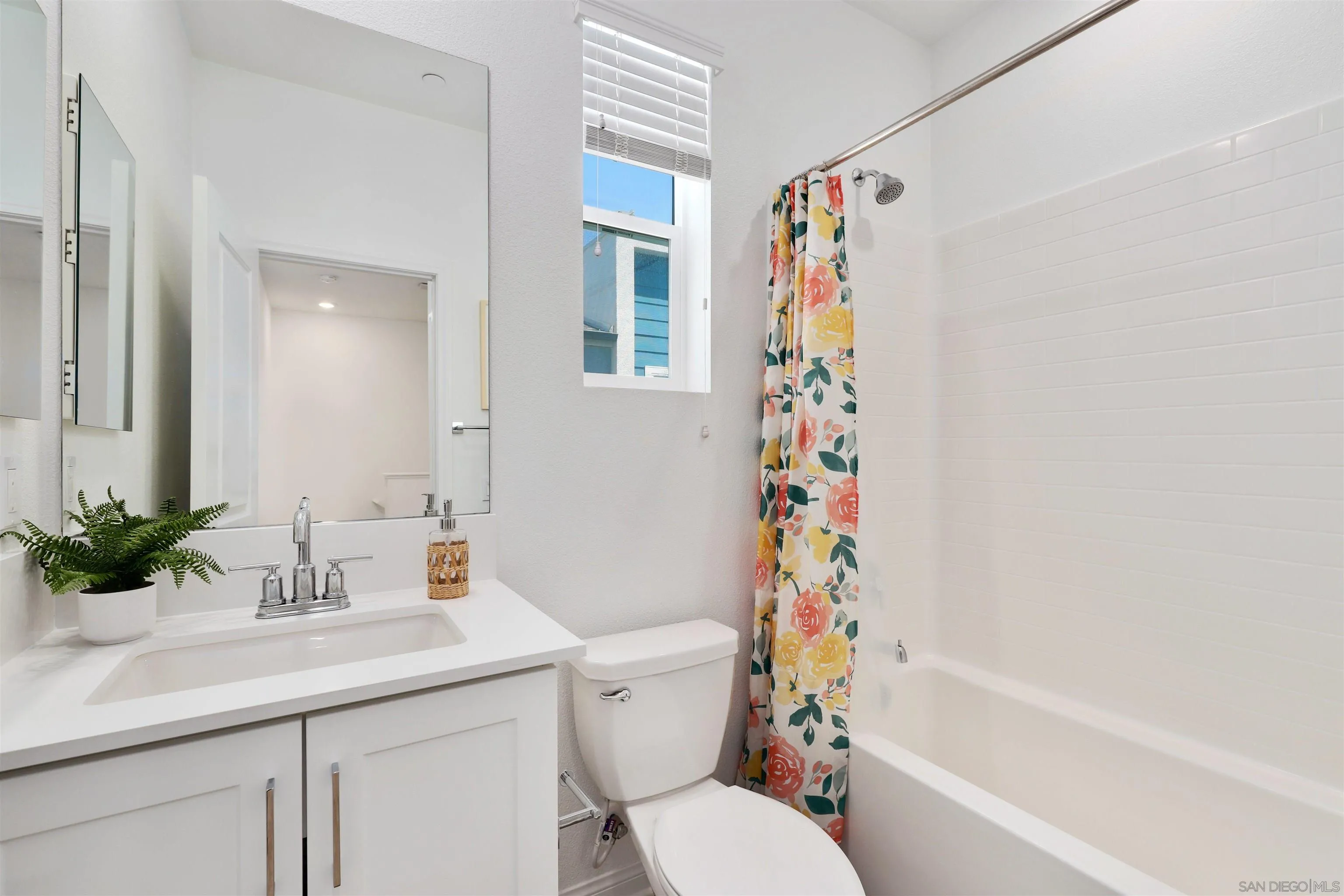 1982 Affinity Lane Chula Vista, CA 91915 - Photo 20 of 34 a bathroom with a sink a toilet and a bathtub