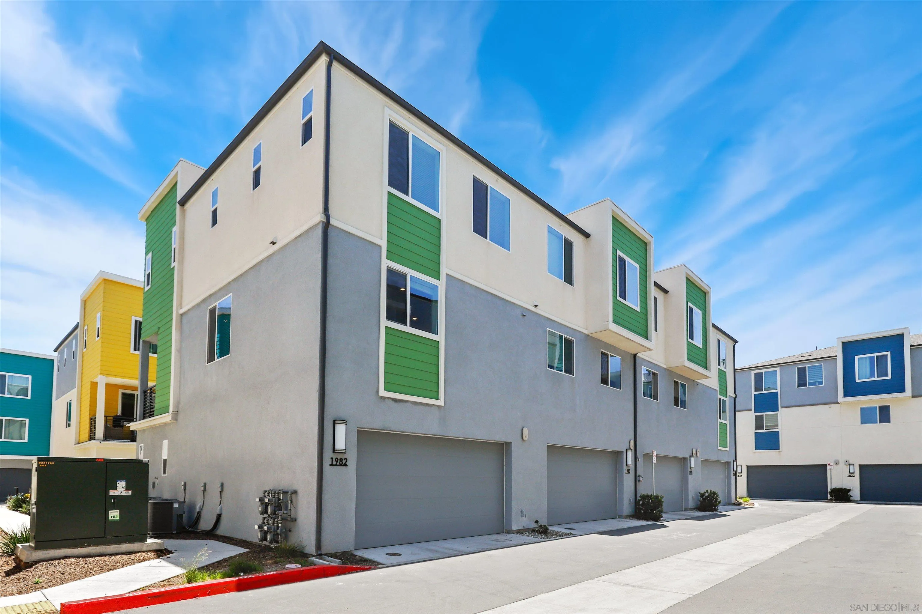1982 Affinity Lane Chula Vista, CA 91915 - Photo 2 of 34 a front view of a building with a street