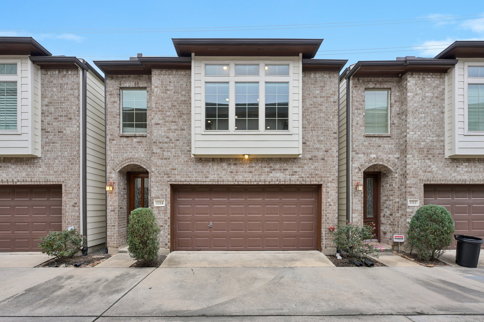 a front view of a house with garage