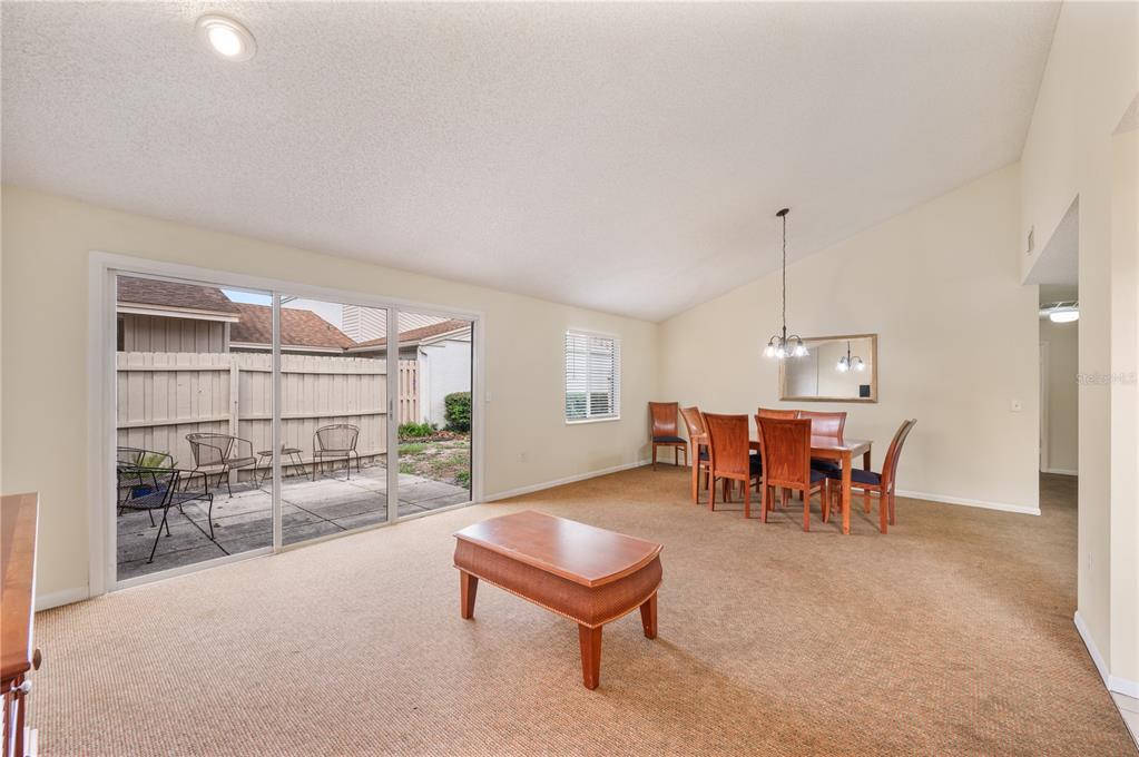 4231 Oak Loop, Unit 51 Mulberry, FL 33860 - Photo 9 of 29 a outdoor space with a large window and furniture