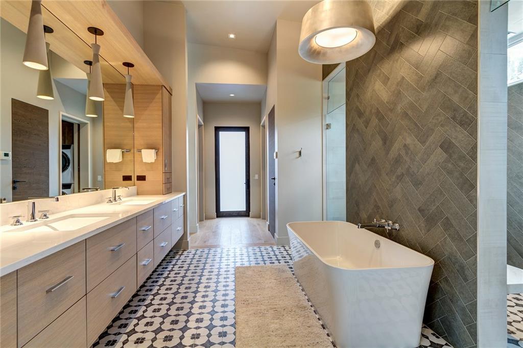 2989 Tiger Road Breckenridge, CO 80424 - Photo 11 of 30 a spacious bathroom with a sink a toilet and a large mirror