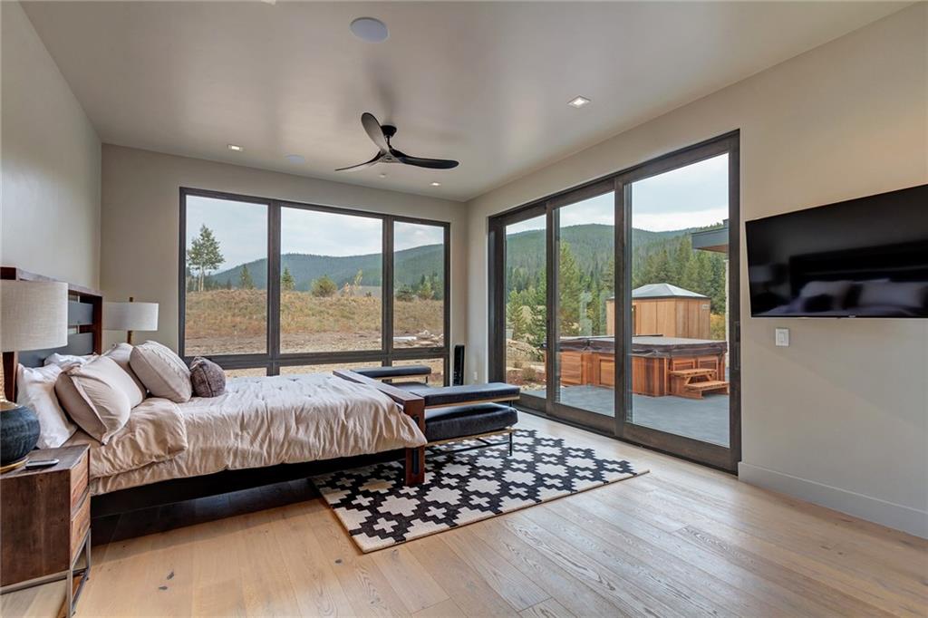 2989 Tiger Road Breckenridge, CO 80424 - Photo 16 of 30 a bedroom with bed and glass door