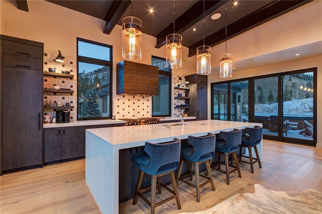 2989 Tiger Road Breckenridge, CO 80424 - Photo 3 of 30 a dining table with chairs and wooden floor