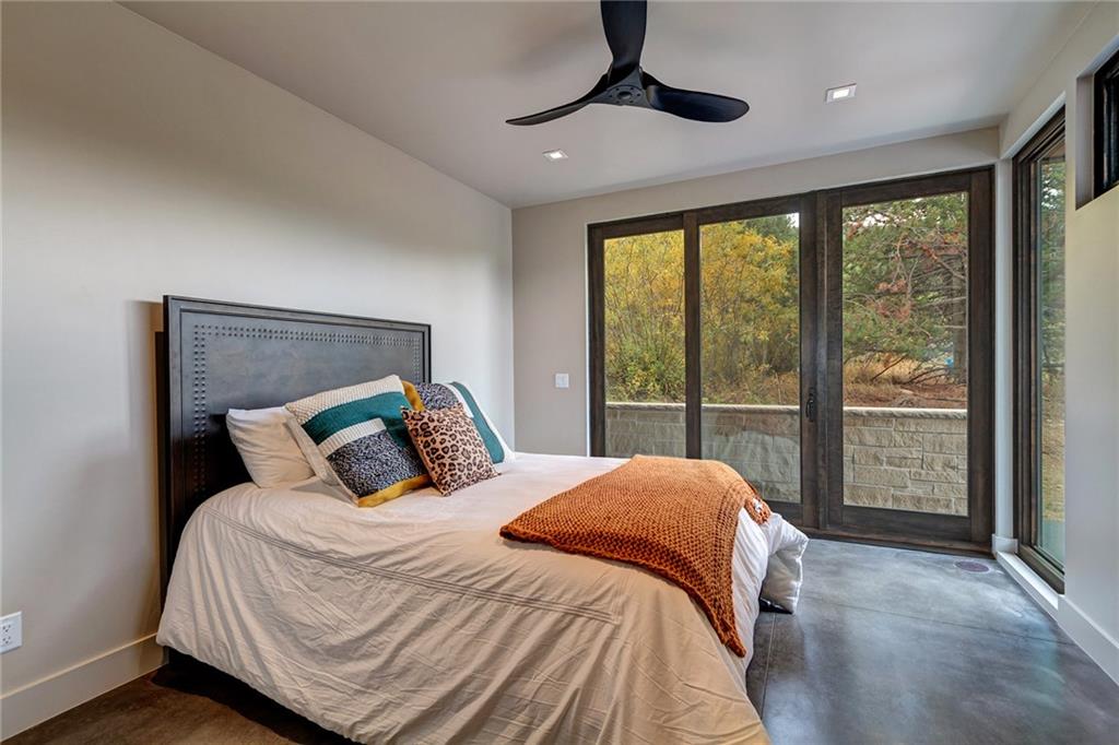 2989 Tiger Road Breckenridge, CO 80424 - Photo 23 of 30 a bedroom with a large bed and a large window