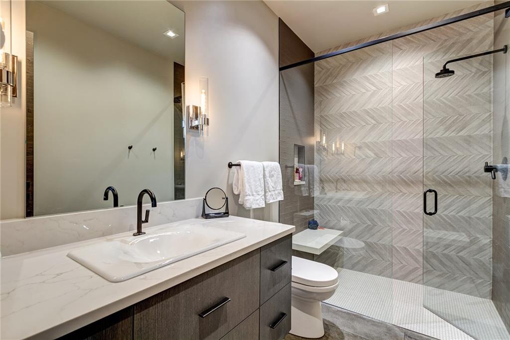 2989 Tiger Road Breckenridge, CO 80424 - Photo 24 of 30 a bathroom with a sink a toilet and shower