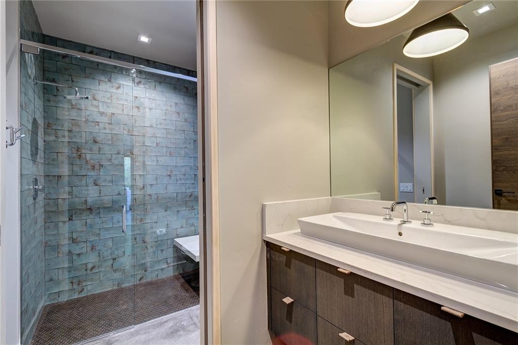2989 Tiger Road Breckenridge, CO 80424 - Photo 25 of 30 a bathroom with a sink shower and a mirror