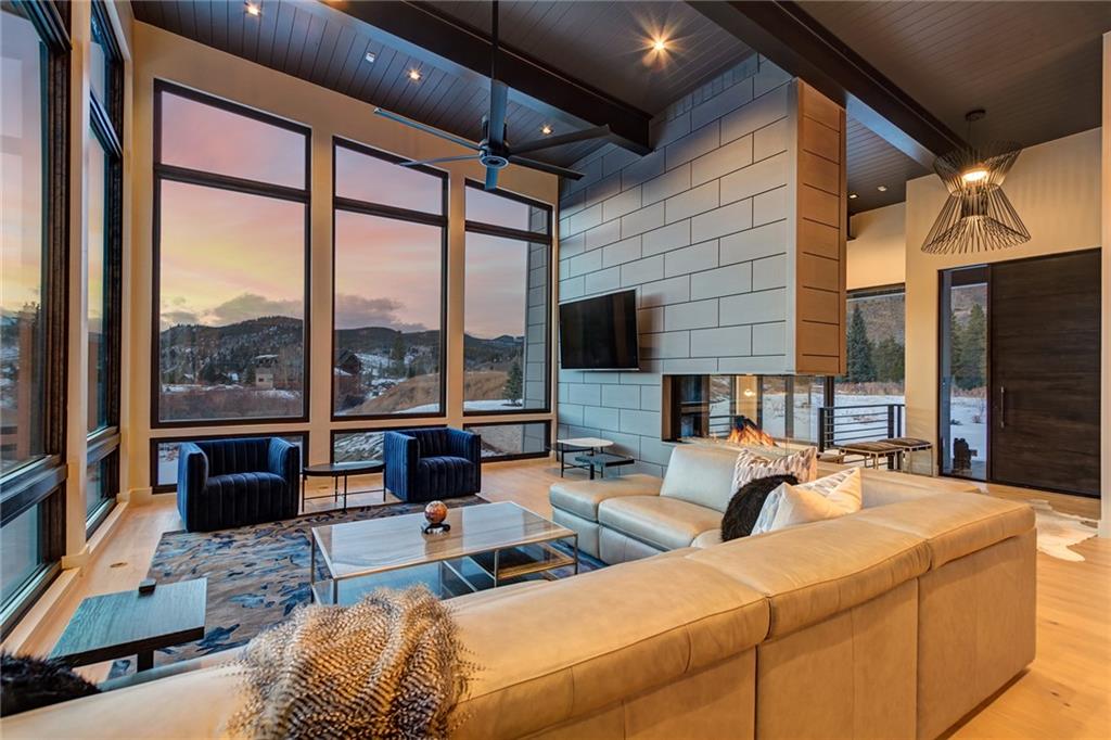 2989 Tiger Road Breckenridge, CO 80424 - Photo 7 of 30 a living room with furniture and large windows