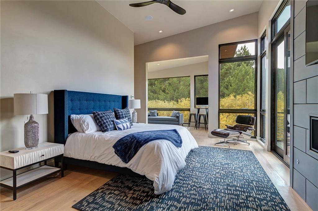 2989 Tiger Road Breckenridge, CO 80424 - Photo 9 of 30 a bed room with a bed and a chair