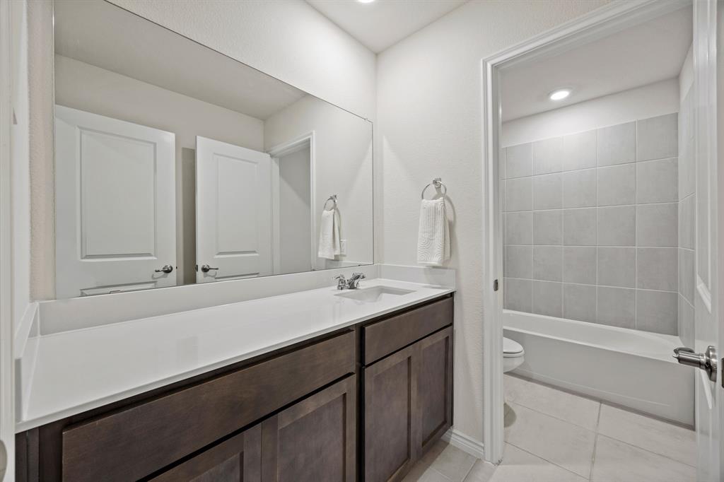 700 Cool Cyn Trail Princeton, TX 75407 - Photo 15 of 18 a bathroom with a sink and a mirror