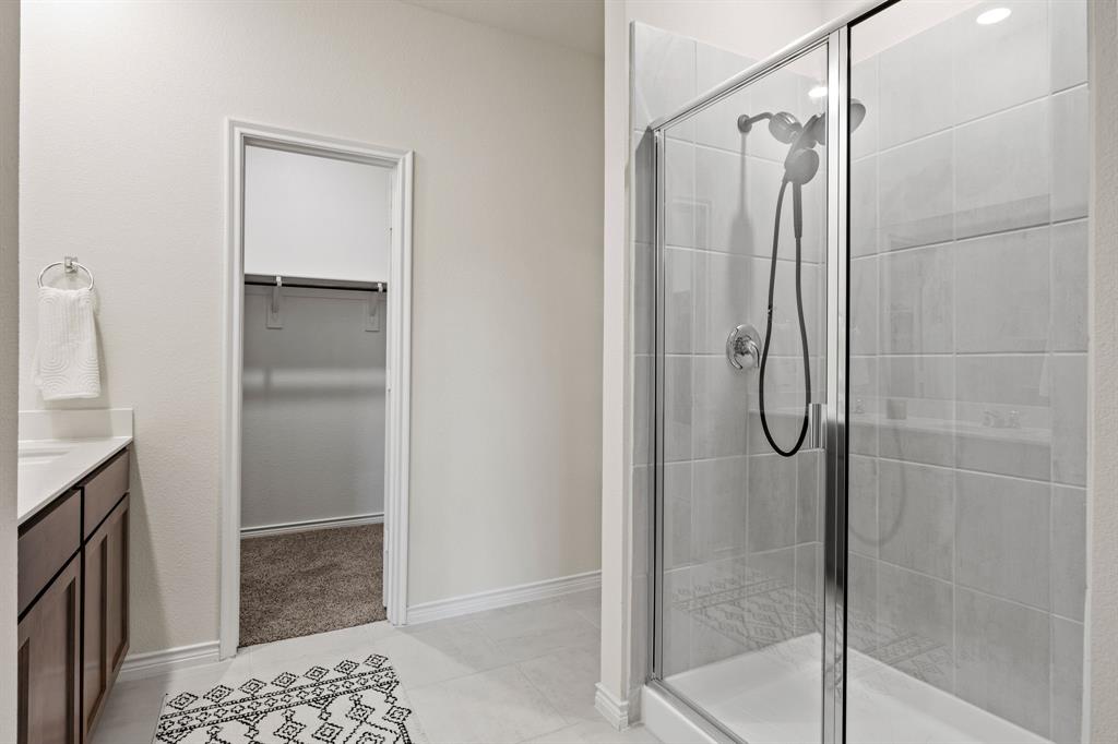 700 Cool Cyn Trail Princeton, TX 75407 - Photo 10 of 18 a bathroom with a shower and a sink