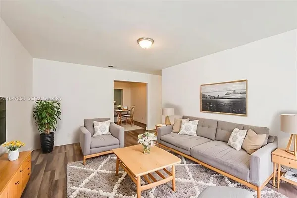 a living room with furniture and a rug