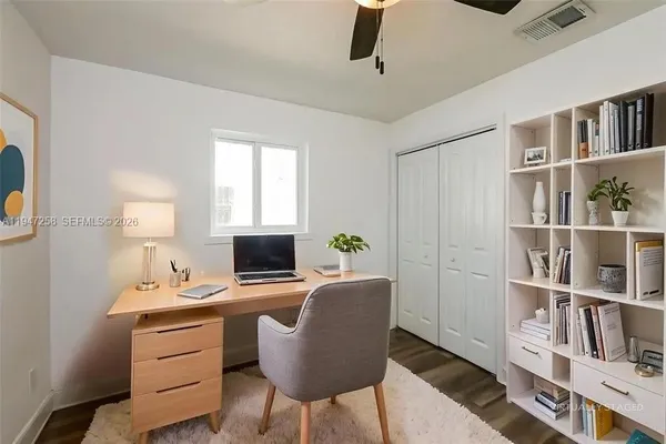 a workspace with furniture and bookshelf