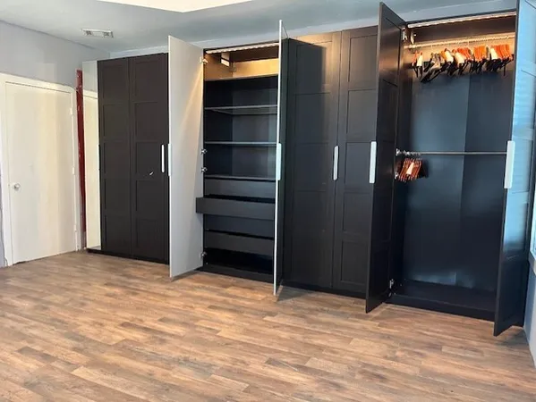 a view of room with walk in closet and window