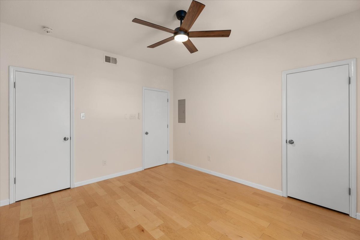 4711 Spicewood Springs Road, Unit 4222 Austin, TX 78759 - Photo 20 of 35 Light wood flooring and two closets define this adaptable interior space.
