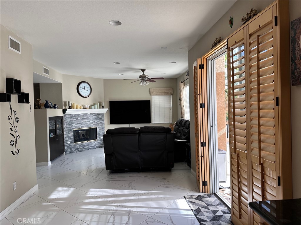 24336 Caladium Place Valencia, CA 91354 - Photo 7 of 25 a living room with furniture and a flat screen tv