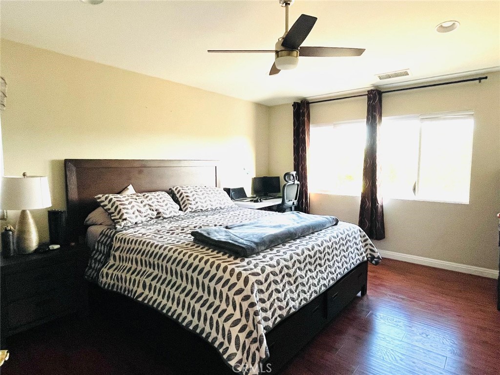 24336 Caladium Place Valencia, CA 91354 - Photo 8 of 25 a bedroom with a bed and a window