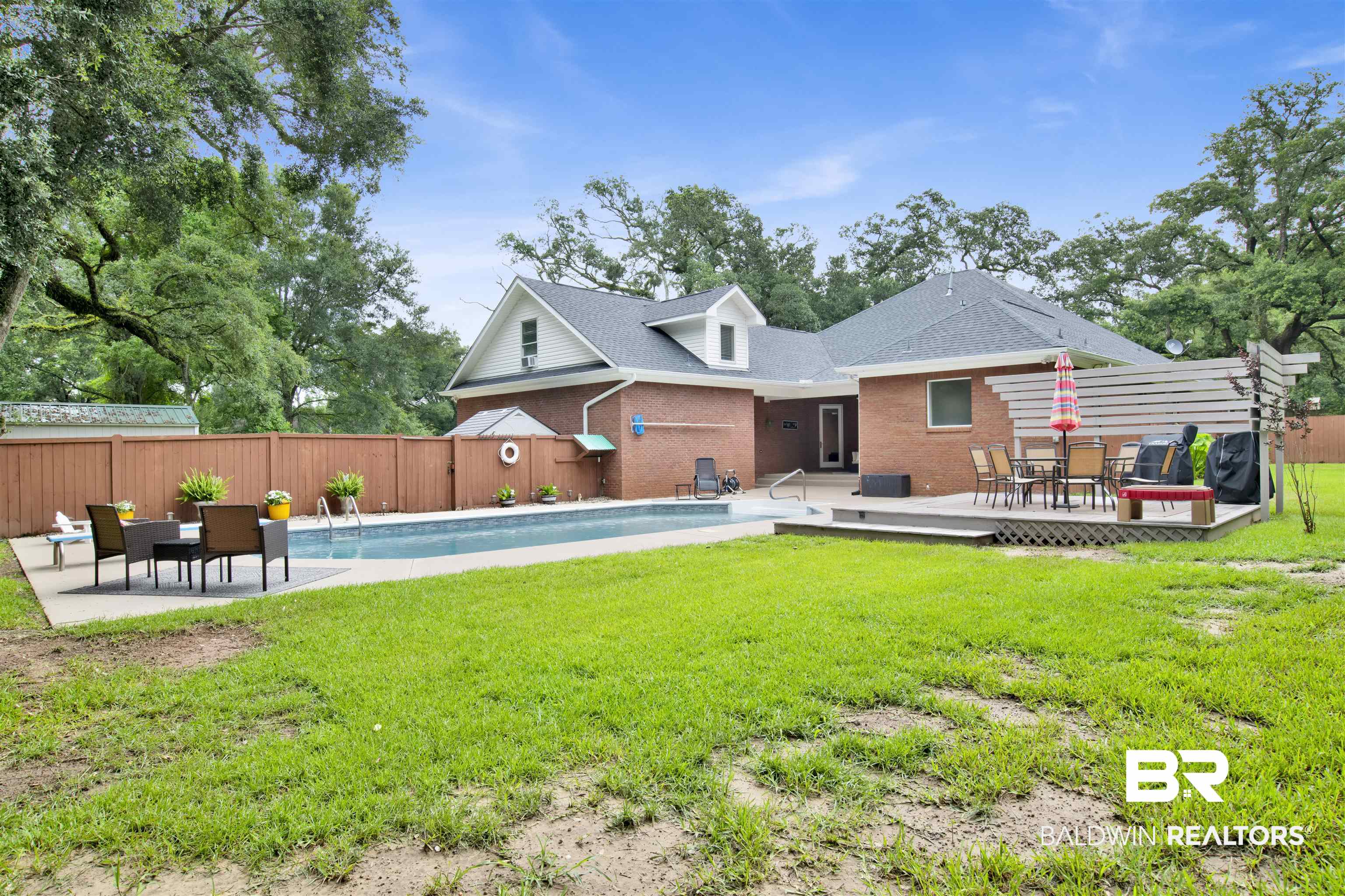 4340 Hamilton Oaks Lane Mobile, AL 36695 - Photo 44 of 51 Rear view of house with a lawn and a fenced in pool
