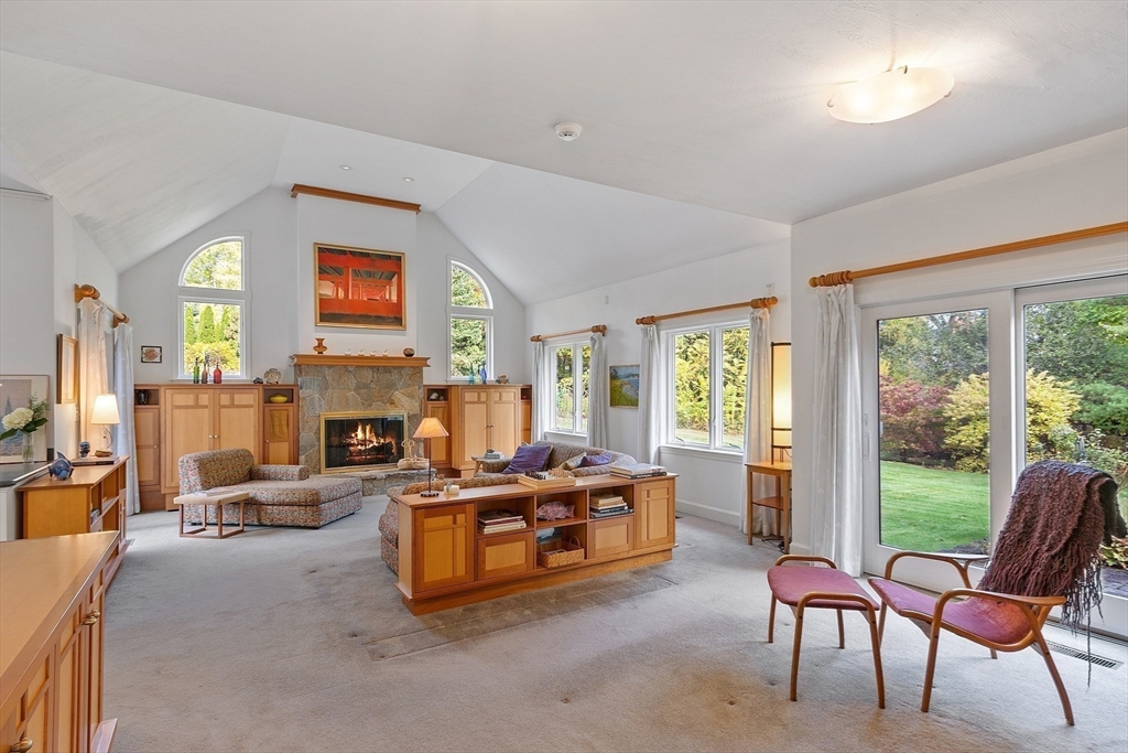 4 Hazelwood Circle Andover, MA 01810 - Photo 12 of 42 a living room with furniture and a fireplace