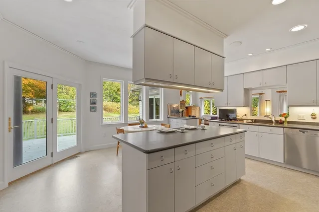 a kitchen with counter top space sink and center
