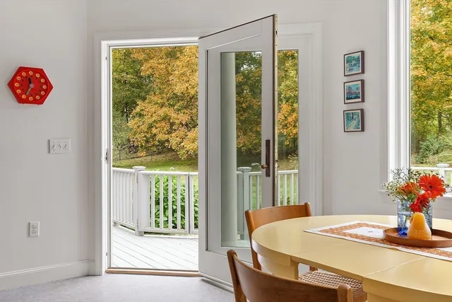 a dining room with a table and chairs