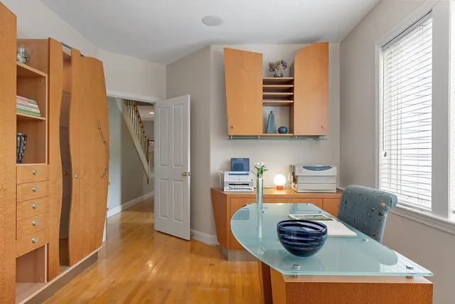 a kitchen with stainless steel appliances granite countertop a sink and a refrigerator