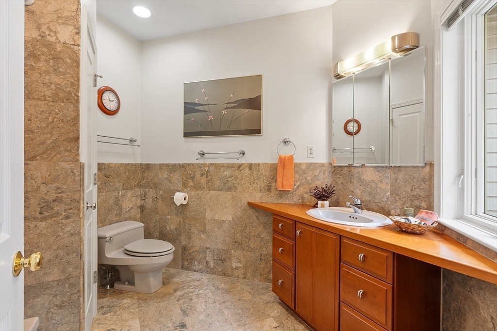 4 Hazelwood Circle Andover, MA 01810 - Photo 25 of 42 a bathroom with a toilet sink and mirror