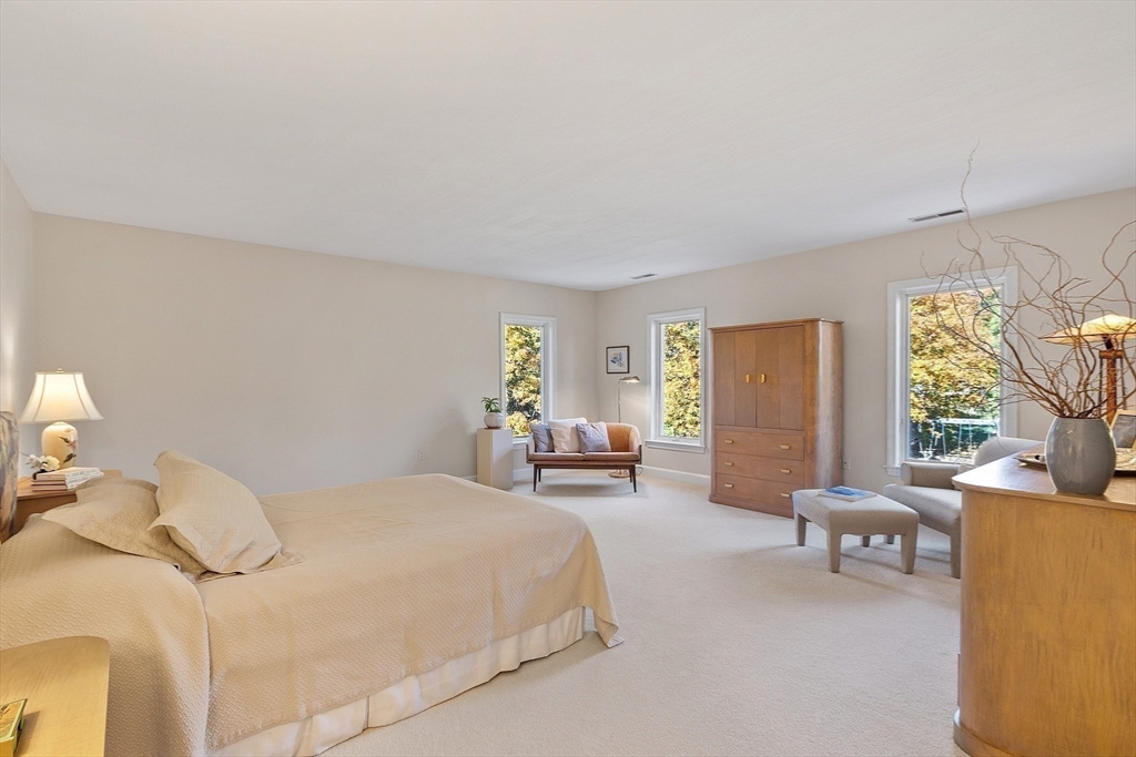 4 Hazelwood Circle Andover, MA 01810 - Photo 29 of 42 a bedroom with a bed and a couch