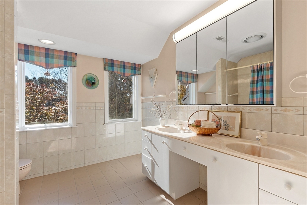 4 Hazelwood Circle Andover, MA 01810 - Photo 35 of 42 a bathroom with a sink and a mirror
