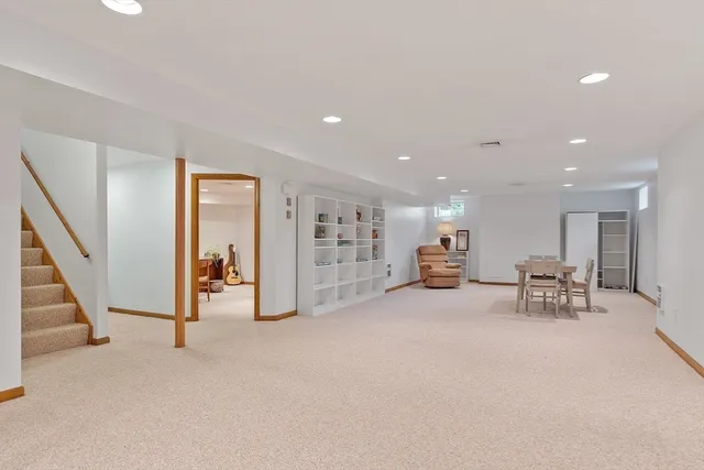 a view of a dining room with furniture and window