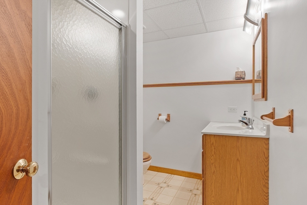 4 Hazelwood Circle Andover, MA 01810 - Photo 39 of 42 a bathroom with a sink and a mirror