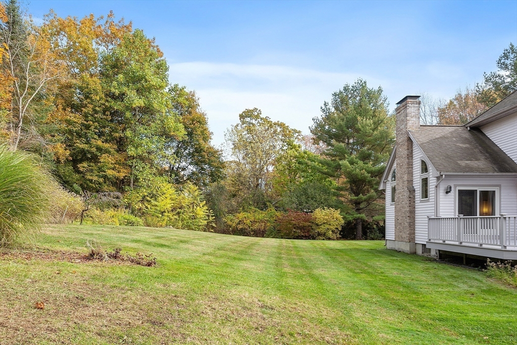 4 Hazelwood Circle Andover, MA 01810 - Photo 6 of 42 a backyard of a house with lots of green space