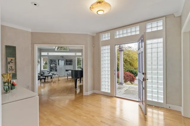 a view of a livingroom with furniture and floor to ceiling window